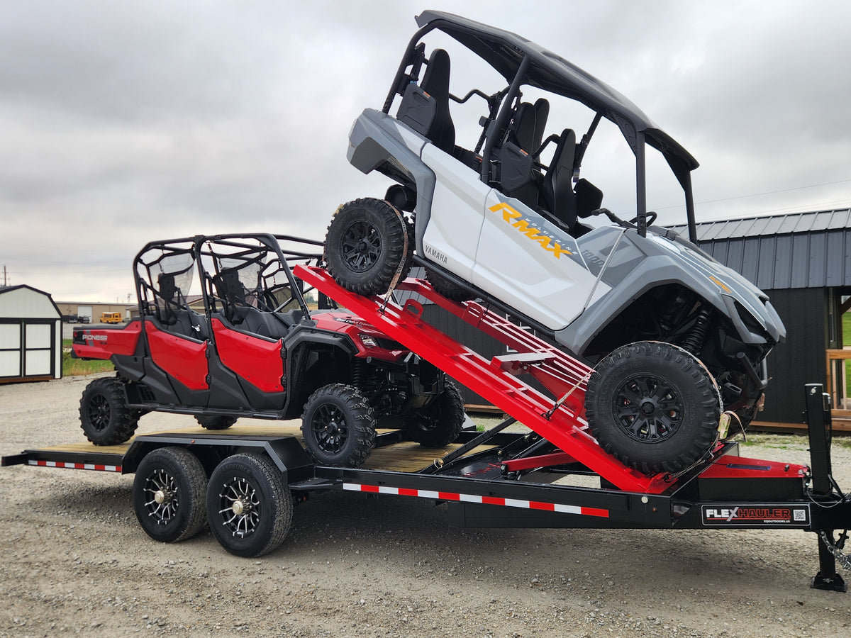 Side-by-side raised on the Flex Hauler lift while a second loads underneath